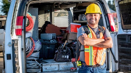 Contractor in front of work van