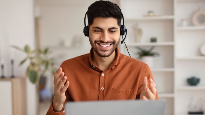 Man giving webinar presentation on laptop